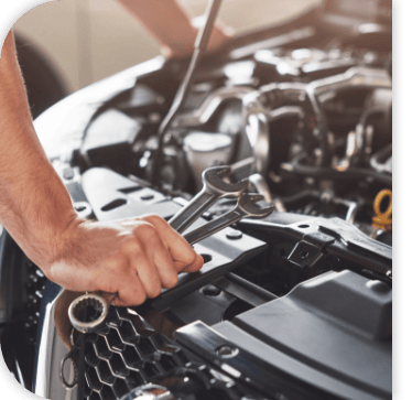 Mitsubishi service technician working on a vehicle